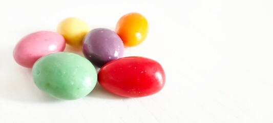 chocolate easter eggs. colorful candies on a white background