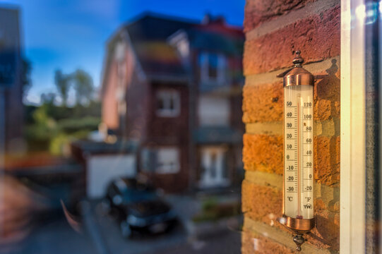 Analog thermometer on a house wall showing temperature over 50�C in Grevenbroich.