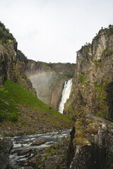 Majestic Vøringsfossen Waterfall (from below) with Rainbow in Verdant Canyon, Norway