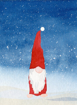 Christmas card with a gnome in the snow and copy space in an authentic watercolor painting