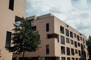 Modern apartment complex in a German city under cloudy skies