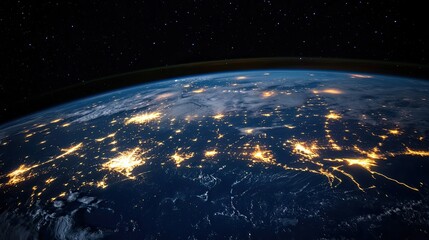 Obraz premium Earth at night, showing city lights and stars.