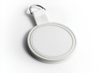 Circular white badge holder with strap and metal clip on white background