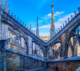 Flying buttresses in Gothic style on the roof of Milan Cathedral, Italy