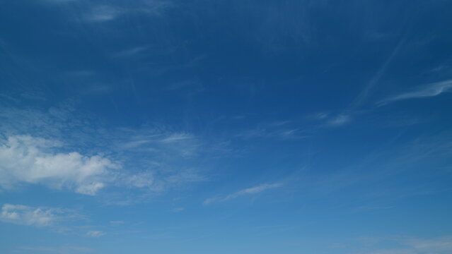 Beautiful blue sky with clouds at day as abstract background. Fresh air. Timelapse.