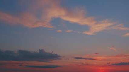 Sky different shades sunset. Dramatic blue, colorful clouds. Sunset sky with clouds background. Timelapse.