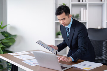 Fototapeta premium Business professional engaging in data analysis modern office digital workspace focused environment strategic insights