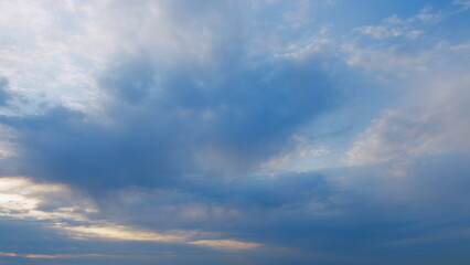 Different shades colored clouds during sunset. Only the sky above the horizon. Timelapse.