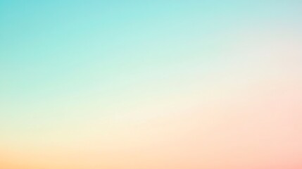 Obraz premium A soft, blurred gradient background in pastel shades of blue, green, yellow, and pink.