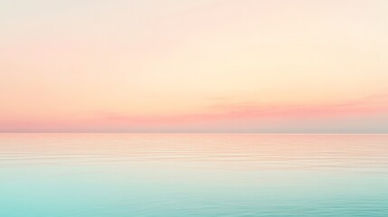 Obraz premium A soft, blurred image of the ocean and sky at sunset.