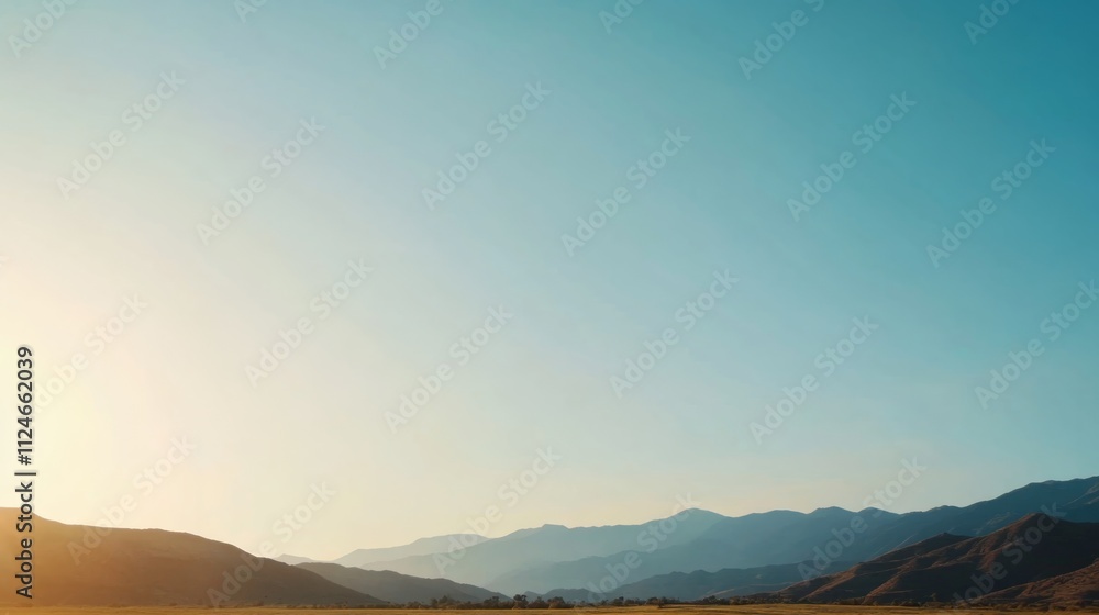 Poster Gently rolling hills stretch across the horizon, illuminated by diffuse light, casting subtle shadows that enhance the tranquil landscape