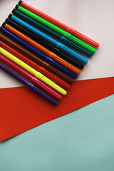 Colorful Crayons and flomasters on paper background stock photo