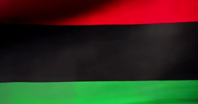 African flag-inspired banner for Black History Month, Juneteenth, and freedom themes. Vibrant profile of an African American man, and woman with iconic colors. 4K looping video