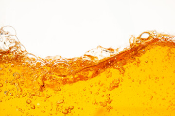 Close up bright orange Oil or beer splash texture and nature waves, Beautiful waves curve and...
