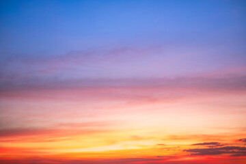 Fototapeta premium Sky,sunset, beautiful , luxury soft gradient orange gold clouds and sunlight on the blue sky perfect for the background, Sunrise on morning or evening in winter warm time ,Twilight summer,silhouette
