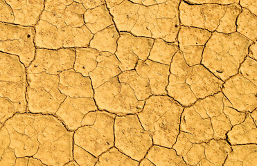 Cracked soil of earth due to climate change. Dry lake in process of drought, lack of rain, moisture. Global natural disaster. Hydrological drought, ecological catastrophy. Cracked soil due to drought.