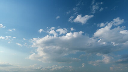 Obraz premium Sky after the storm. Majestic amazing blue sky with stratocumulus clouds. Nature cumulus clouds moving. Timelapse.