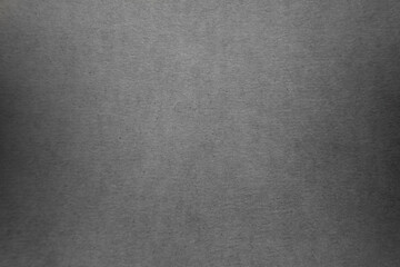 Light black paint on blank eco environmental friendly cardboard box paper texture background with space minimal simple style 
