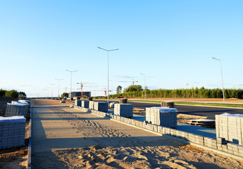 Sidewalk Tiles Laying on street in city. Laying Paving Slabs on construction site. Stone paving slab on sidewalk. Sidewalk tile paving for footpath. Pedestrian road construction and renovation.
