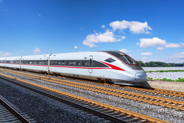 Modern High-Speed Train in Scenic Environment with Clear Blue Sky