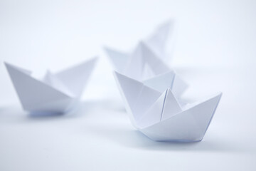 paper boats on the documents