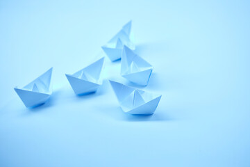 paper boats on the documents