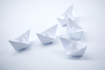 paper boats on the documents