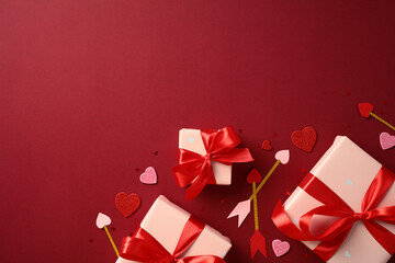 Valentine's Day gifts with red ribbons on a red background, surrounded by heart-shaped decorations and Cupid's arrows. Perfect for romantic holiday themes and celebrations.
