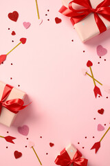 Valentine's Day flat lay with gift boxes wrapped in red ribbons, glitter hearts, and decorative arrows on pastel pink background. Romantic banner design for social media, stories, poster template.