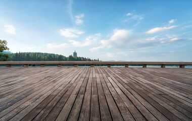 Scenic Wooden Deck Overlooking a Serene Landscape with Towering Trees