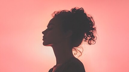 in a pale pink background, a close-up of woman in a frontal pose, silhouette, backlight, contrast