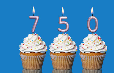 Birthday Cupcakes With Candles Lit Forming The Number 750