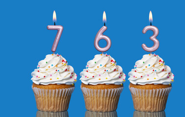 Birthday Cupcakes With Candles Lit Forming The Number 763