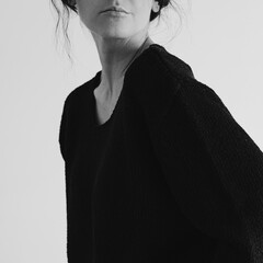 Elegant Female Portrait in Simple Black Sweater. Modern Minimalist Fashion. Black and White,...