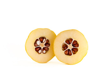 Two halves of a fresh quince in cross-section with seeds prominently visible