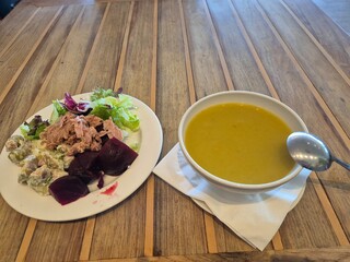 Salad And Soup On A Wooden Table