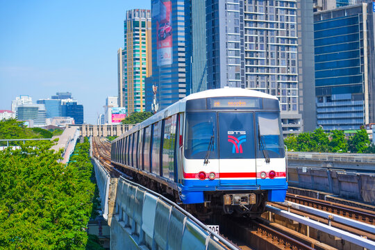 View of Bangkok skyline and skyscraper with BTS skytrain BTS sky train runs through the Mo Chit Station Chatuchak Park station. 25 november 2023