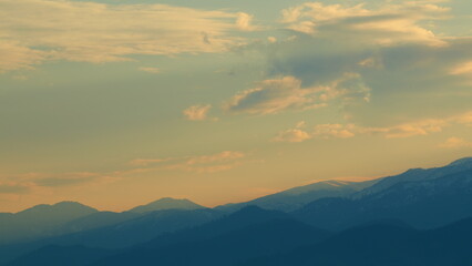 Mountain Top With Sunset. Clouds Float. Blue And Orange Clouds Flow In Sky. Pan.