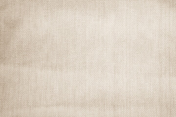 Closeup detail of beige fabric texture background. High resolution photo.