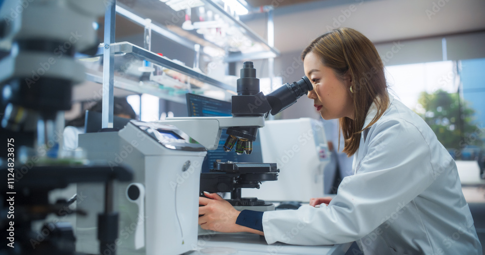 Poster medical research and development laboratory: beautiful asian female scientist working on a computer 