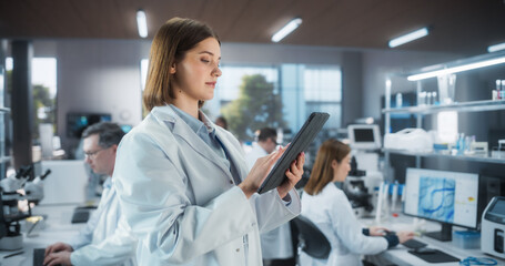 Portrait of an Attractive Female Scientist Posing for Camera, Smiling. Young Biologist Standing in...