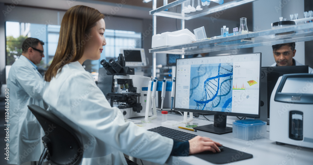Poster asian female scientist working on a desktop computer, analyzing dna samples. specialist using a gene