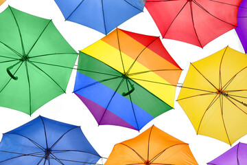 One umbrella in LGBT colors among others, bottom view. Tolerance and acceptance