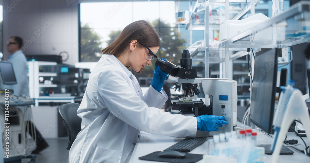 Poster portrait of a beautiful caucasian student working on a research project in university. medical resea