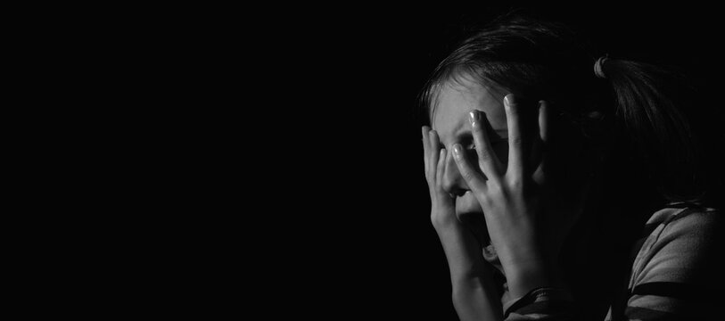 Crown of thorns and rosary beads on brown texture background with space for text