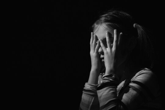 Crown of thorns and rosary beads on brown texture background with space for text