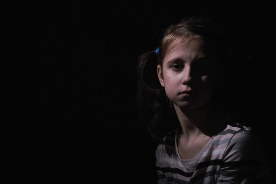 Crown of thorns and rosary beads on brown texture background with space for text