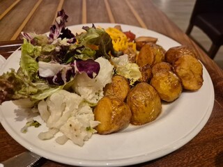 Potatoes and salad dish on a plate