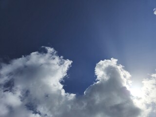 Obraz premium White fluffy cumulus clouds in the summer sky