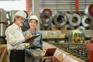 Two professional technician engineer worker use clipboard checking operating equipment machine...